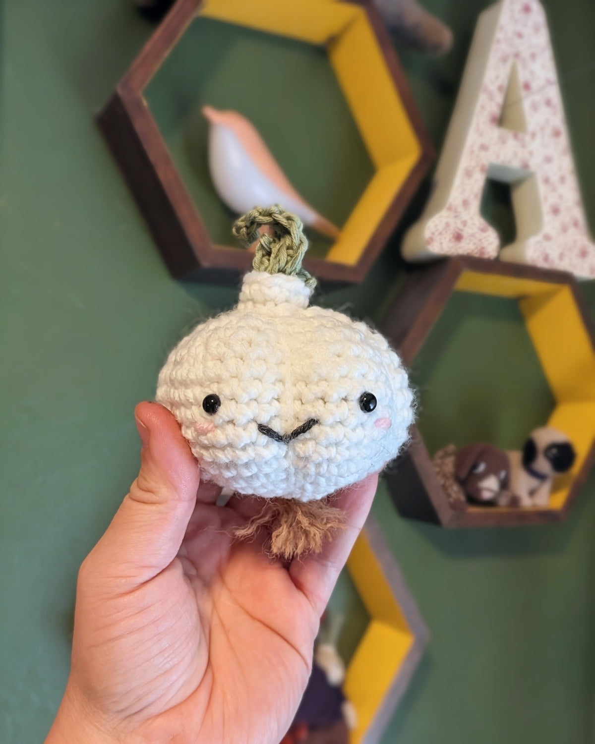 Crochet garlic plush in hand