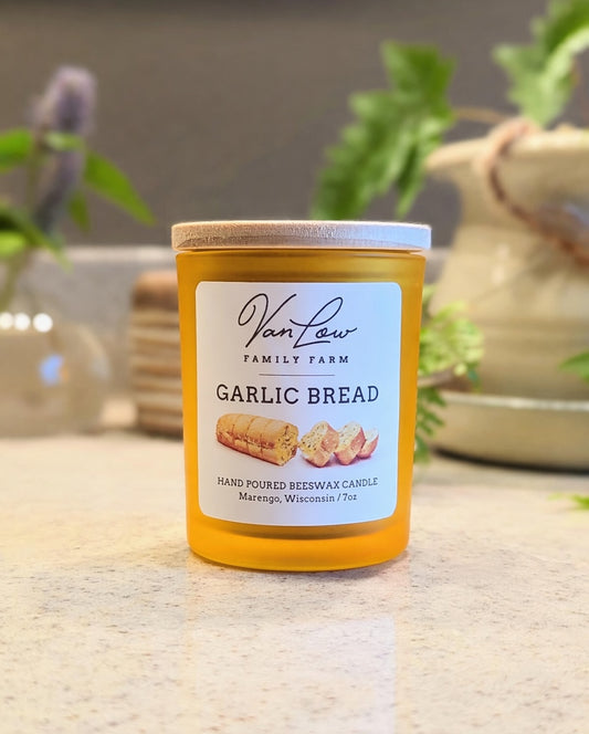 Garlic Bread beeswax candle from Van Low Family Farm, Marengo Wisconsin, on a kitchen counter