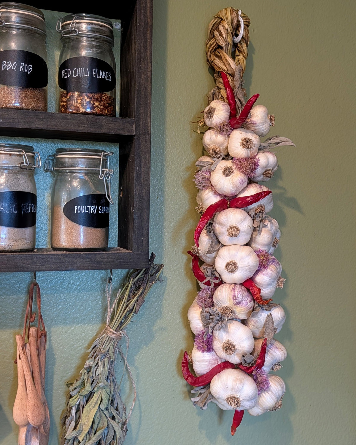 Large pepper and herb garlic braid hanging by the spice shelf