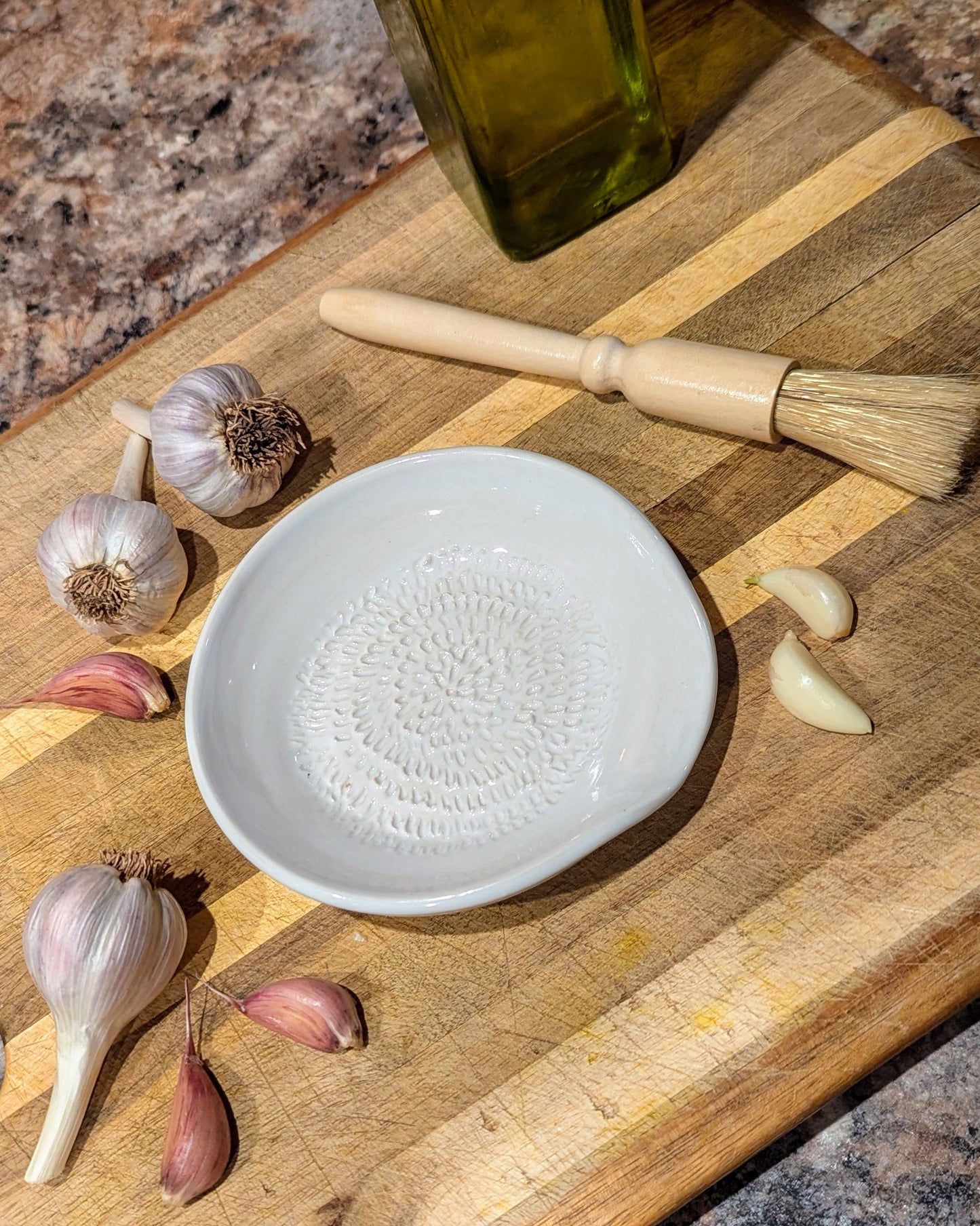 Ceramic garlic grater plate in Porcelain — plate only; wooden brush in photo is a prop